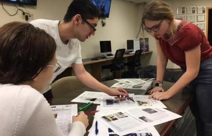 Collegian editors looking over proofs for the next issue